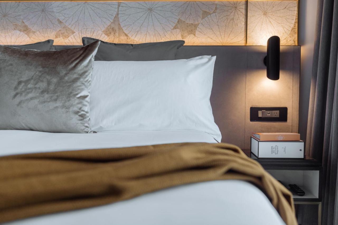 One Global Resorts Green Square Sydney Kültér fotó A bedroom at the hotel