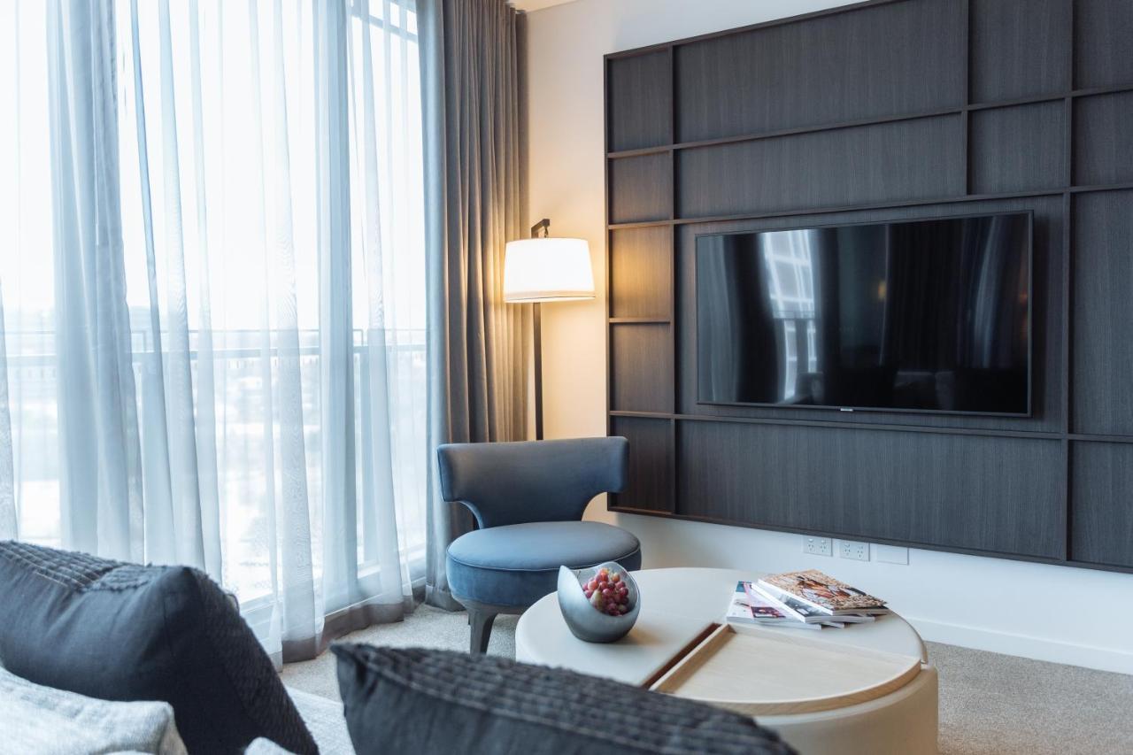 One Global Resorts Green Square Sydney Kültér fotó A living room at the Ritz-Carlton, Kuala Lumpur