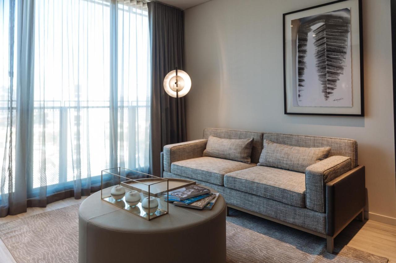 One Global Resorts Green Square Sydney Kültér fotó A living room at The Ritz-Carlton, DIFC